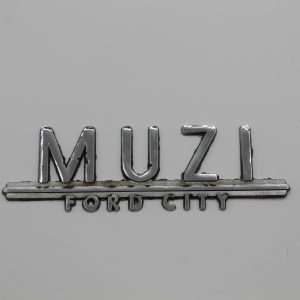 Muzi Ford City Dealer Emblem - Metal